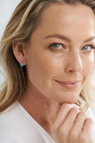 E23-LB - ERIN - Rhodium Plated Tapered CZ And Light Blue Square Earrings
